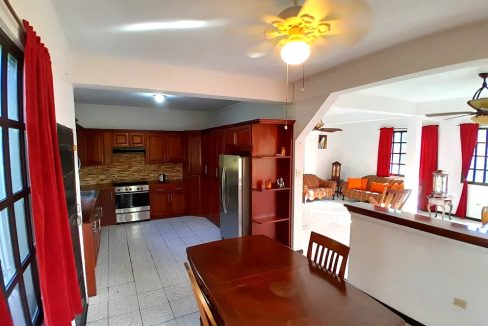 showing-kitchen-breakfast-area-and-flow-in-to-open-concept-dining-and-sitting-area-2