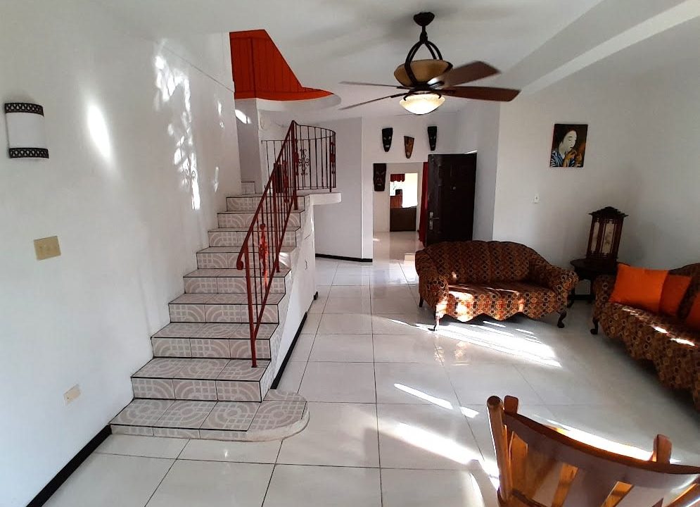 stairs-to-upper-level-and-foyer-to-living-room