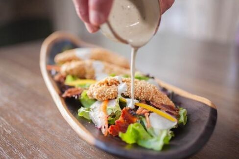 3389_delicioussaladbeingdrizzledwithdressingatitzanabelizeresort