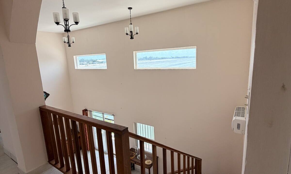 ambergris-caye-canal-front-home-arched-staircase-view
