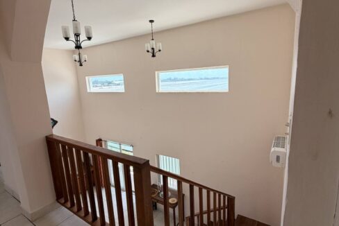 ambergris-caye-canal-front-home-arched-staircase-view